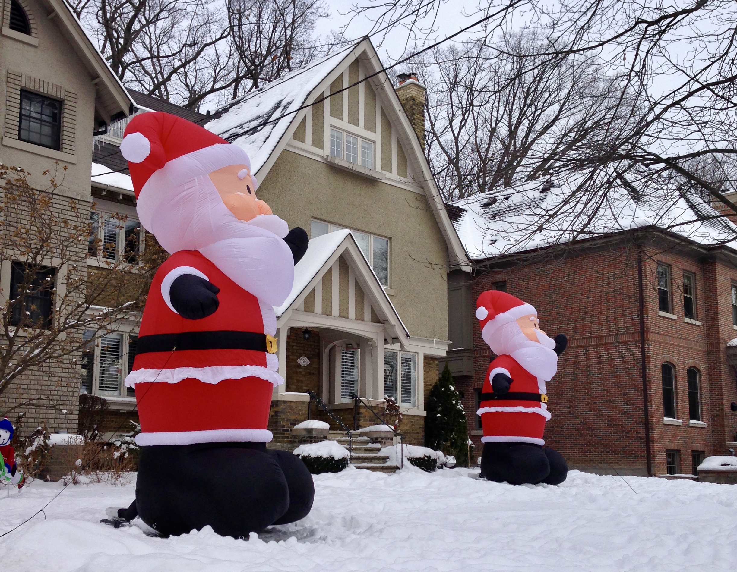 Inflatable Santas on a Moore Park street, an annual neighbourhood tradition